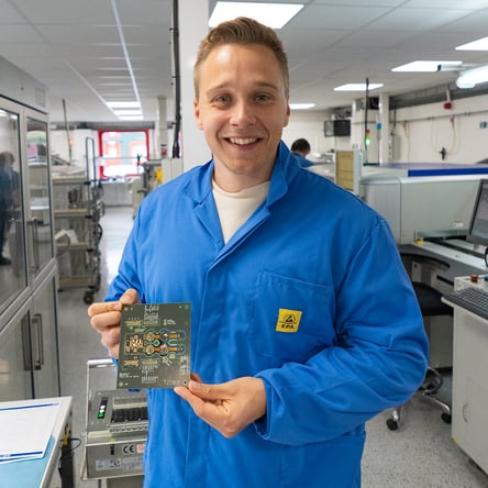 Tom Jelliffe holding Tzuka tech