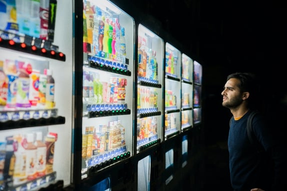 man looking at supermarket products-1